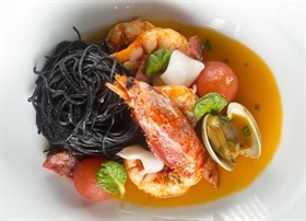 Black Angel Hair Pasta with Sicilian Prawns, Baby Squid, Clams and Picante Salami
