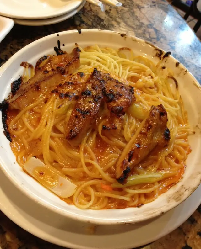 尚未動筷的「鮮茄焗豬扒飯」