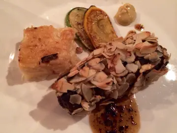 Almond crusted lamb loin stuffed with duck liver and black truffle sauce