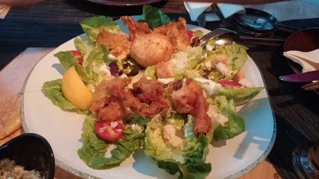Caesar salad with fried runny egg and spider jumbo soft-shell crab