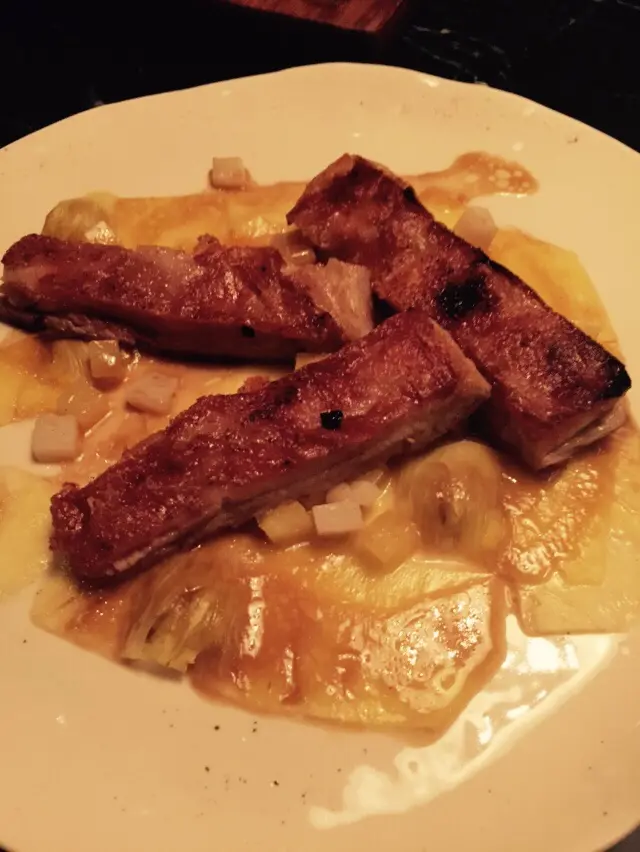 Suckling piglet belly, poached pineapple, confit squid