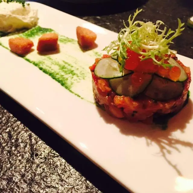 Salmon tartare with black garlic, horseradish foam