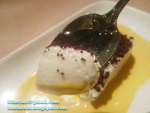 Coconut and Ginger mousse with mango cream and cocoa soil.