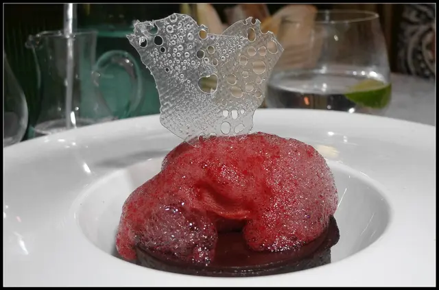 warm chocolate tart with raspberry sorbet