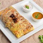 Ceylon Mutton Paratha stuffed with egg and meat, served with sides