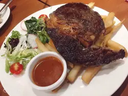 Australian  rib  eyes  fries  all  so  yum  yum  !  