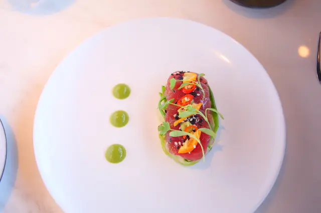 Sliced yellowfin tuna, daikon pomelo peanut salad soy dressing