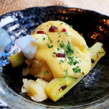 Poached Eggs with Grilled Asparagus, Crushed Potatoes, Ibérico Ham and Hollandaise Sauce