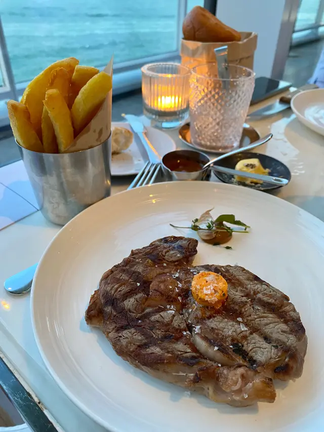 Medium  rare  ribeye  and  fries