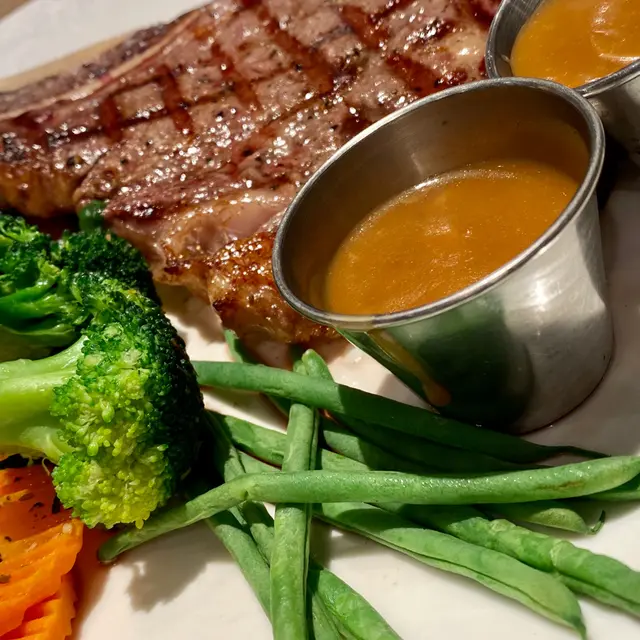 Special 18oz USDA bone-in ribeye steak combo plus half-pint of 1664