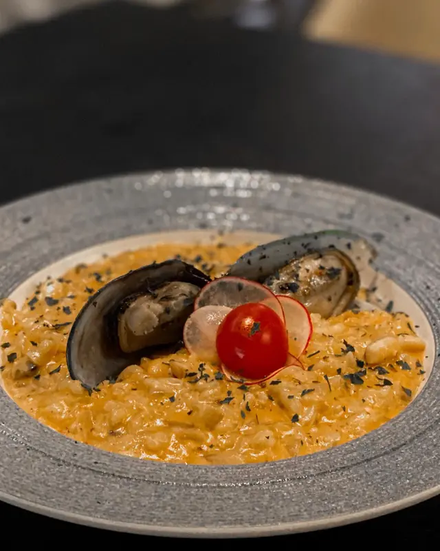 Seafood risotto in lobster bisque sauce