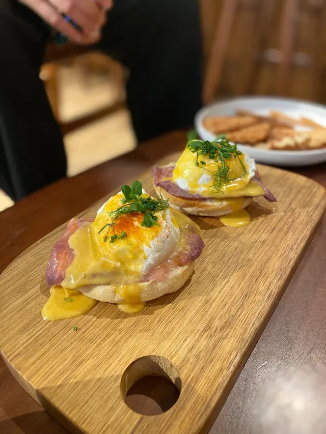 egg benedict with blueberry cured salmon