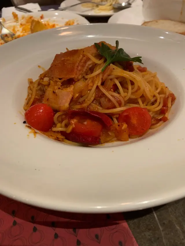 Spicy chilli pasta with bacon & crushed peppers in tomato sauce