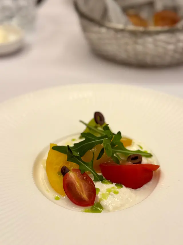 Heirloom tomatoes with vinaigrette, burrata cheese & olives