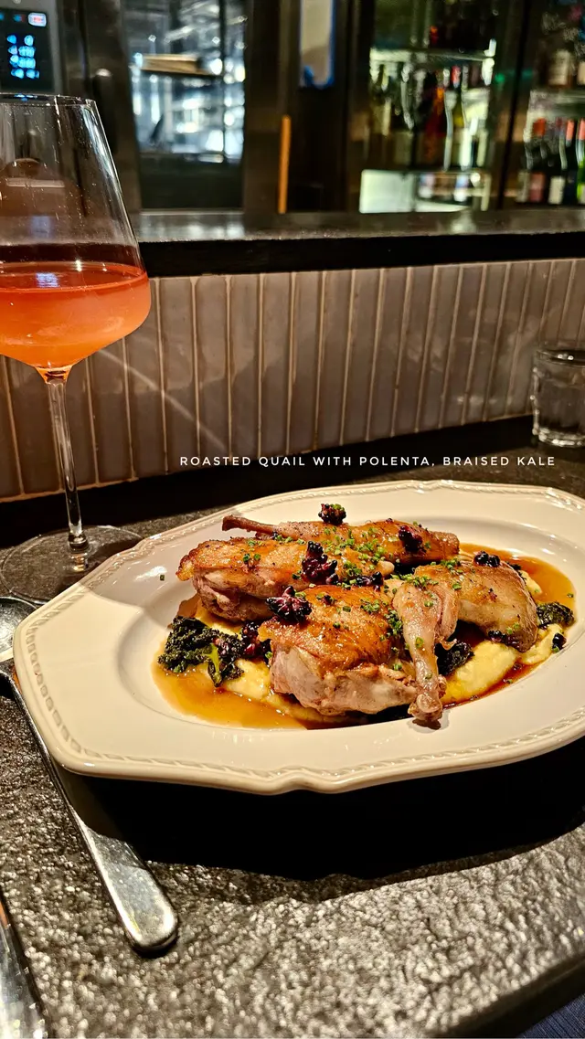 Roasted quail with polenta, braised kale