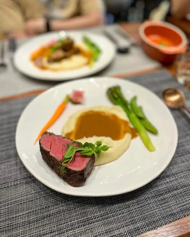 Coconut Husk Smoked 7 oz. Argentinian Black Angus Tenderloin with mashed potato, and seasonal vegetables