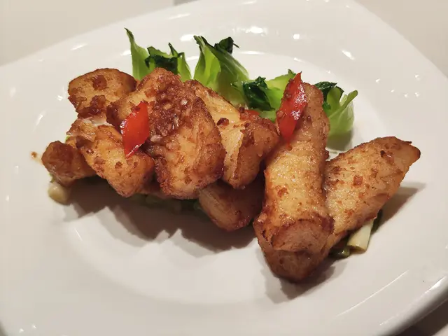 Pan-seared French codfish fillet with spring onion in supreme soy sauce