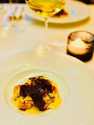 Sautéed potato gnocchi with fresh girolle, japanese leek, spinach, hazelnut cream sauce, black truffle